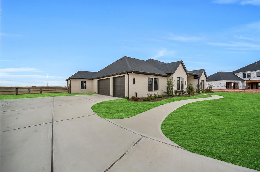 Front exterior of a new home in Lakeview, Waller, TX, highlighting curb appeal (Image 21).