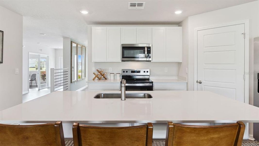 Furnished interior view inside a new home in Bradbury Creek, Haines City (Image 7).