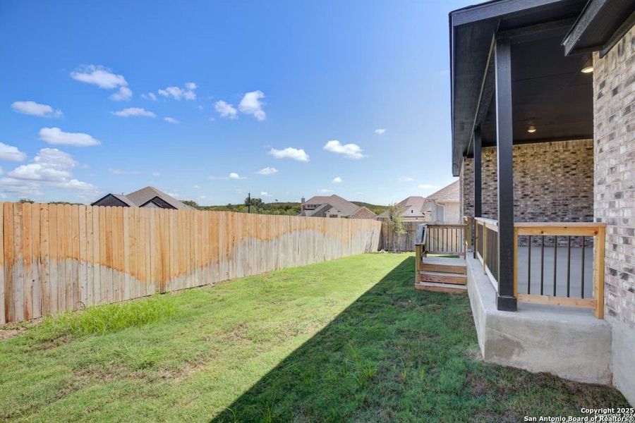 Front exterior of a new home in The Reserve at Potranco Oaks, Castroville, TX, highlighting curb appeal (Image 79).
