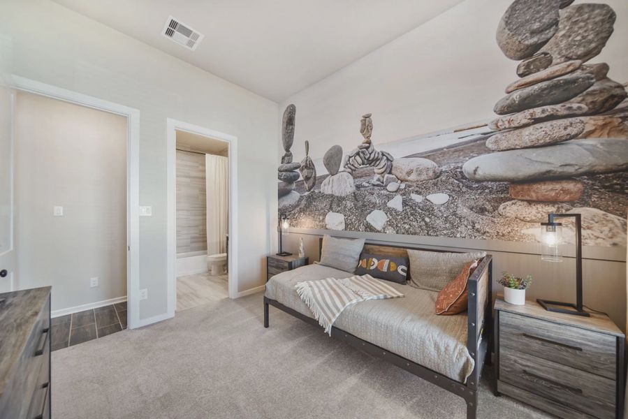 Representative furnished interior of a home built from the Montgomery by Chesmar Homes in Meridiana 50's and 60's, Manvel (Image 10).