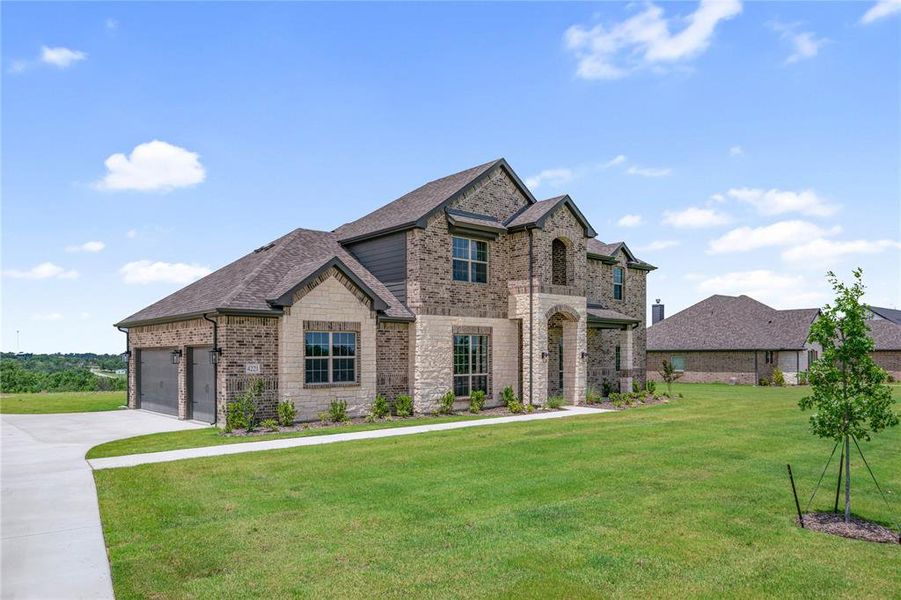 Front exterior of a new home in Eagle Ridge Estates, Weatherford, TX, highlighting curb appeal (Image 24). Front exterior of a new home in Eagle Ridge Estates, Weatherford, TX, highlighting curb appeal (Image 24).