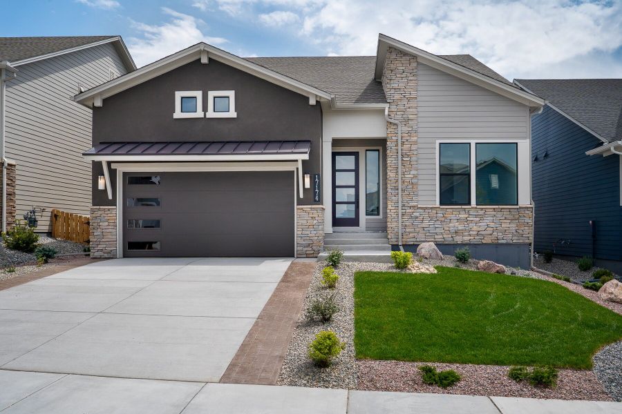 Front exterior of a new home in Cloverleaf – Mountainview Collection, Monument, CO, highlighting curb appeal (Image 1). Front exterior of a new home in Cloverleaf – Mountainview Collection, Monument, CO, highlighting curb appeal (Image 1).