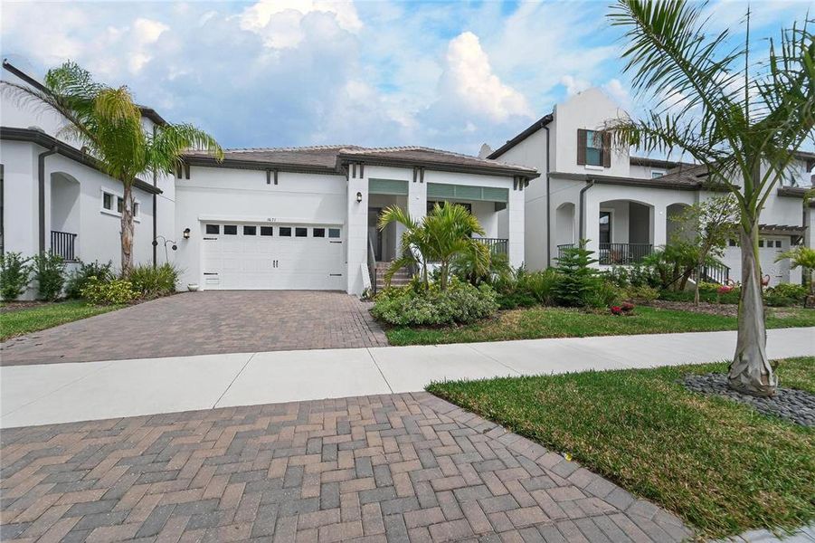 Front exterior of a new home in SouthShore Yacht Club, Ruskin, FL, highlighting curb appeal (Image 26). Front exterior of a new home in SouthShore Yacht Club, Ruskin, FL, highlighting curb appeal (Image 26).