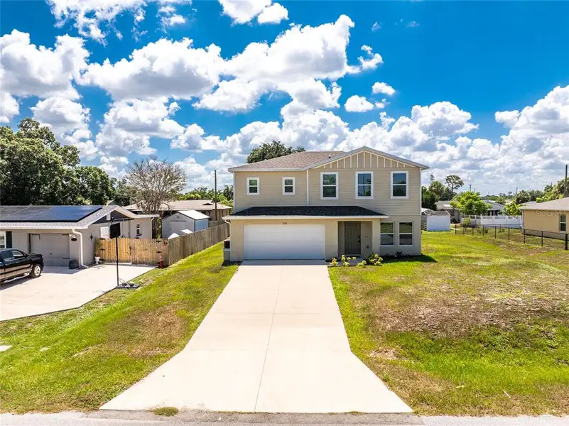 Front exterior of a new home in , Port Charlotte, FL, highlighting curb appeal (Image 26).