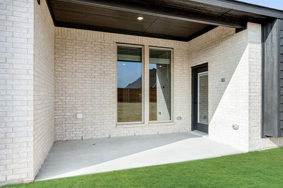 Exterior details and patio area of a home in Sunrise at Garden Valley, Waxahachie (Image 25).