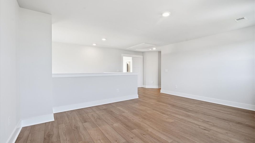 Timeless hardwood flooring makes this loft both stylish and functional