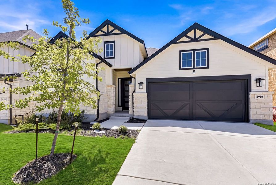 Front exterior of a new home in The Crossvine, Schertz, TX, highlighting curb appeal (Image 21). Front exterior of a new home in The Crossvine, Schertz, TX, highlighting curb appeal (Image 21).
