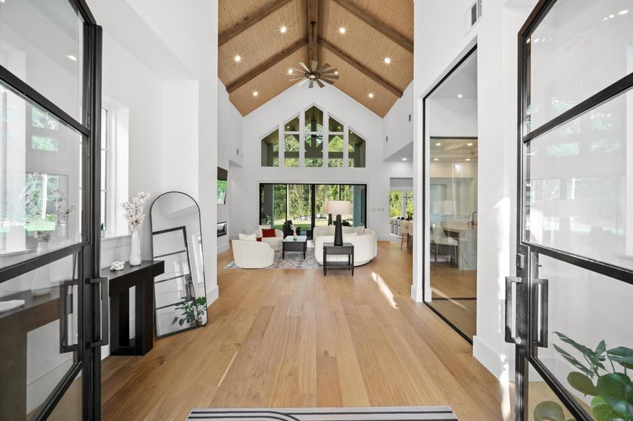 Grand foyer designed to showcase the home's soaring ceilings and open-concept layout.