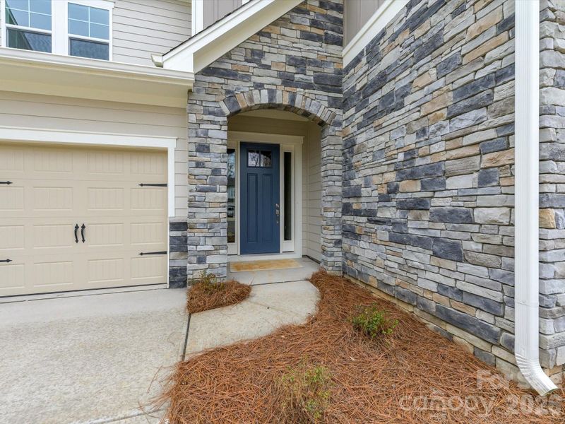 Exterior details and patio area of a home in North Creek Village, Huntersville (Image 25).