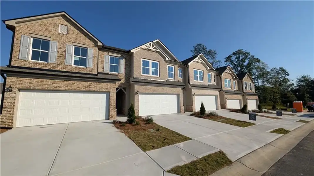 Front exterior of a new home in , Loganville, GA, highlighting curb appeal (Image 2). Front exterior of a new home in , Loganville, GA, highlighting curb appeal (Image 2).
