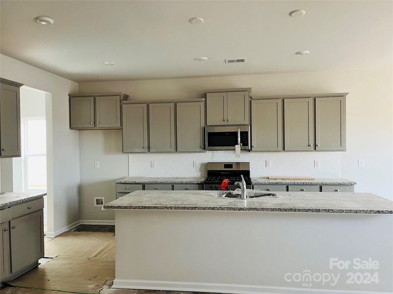 Large kitchen with an abundance of cabinet & counter space