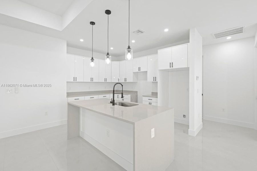 ACTUAL KITCHEN SPACE WITH BACK HALL LEADING TO OTHER BEDROOMS