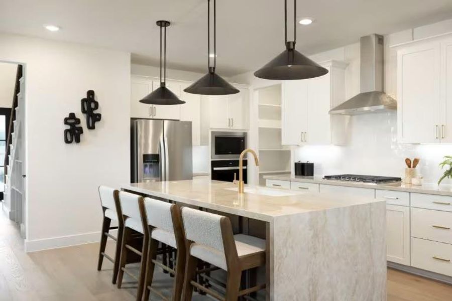 Photo of Pulte model home with same floor plan, not of actual home listed.