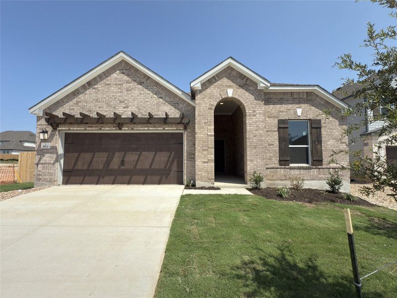 Front exterior of a new home in River Bluff, Leander, TX, highlighting curb appeal (Image 15). Front exterior of a new home in River Bluff, Leander, TX, highlighting curb appeal (Image 15).
