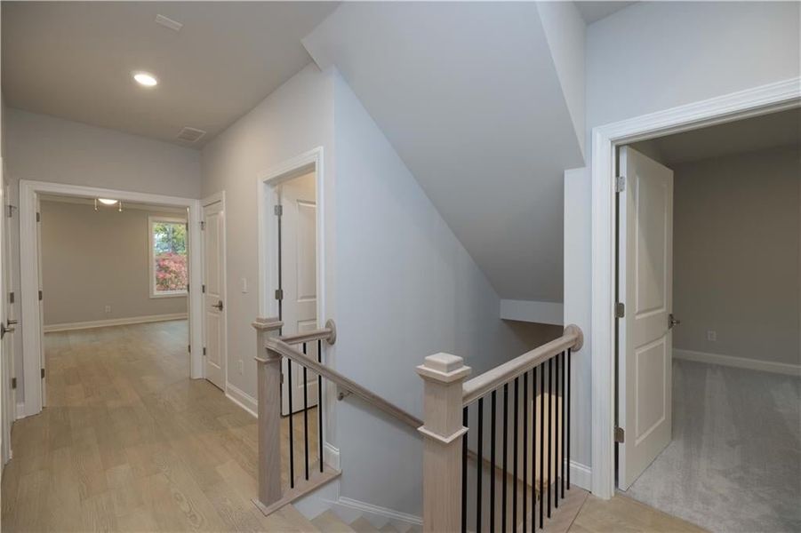 Spacious upstairs hallway. *Please note photos shown are of the Ellington plan but not of the actual home.