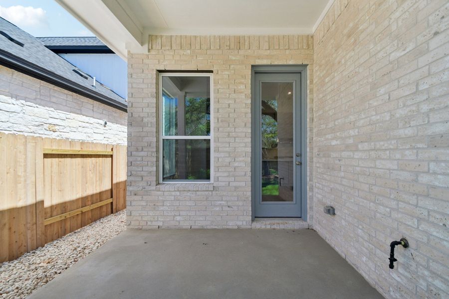 Exterior details and patio area of a home in Persimmon, Buda (Image 15).