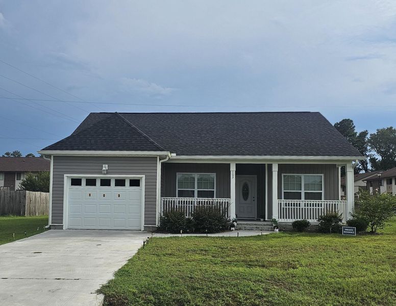 Front exterior of a new home in , St. George, SC, highlighting curb appeal (Image 1).