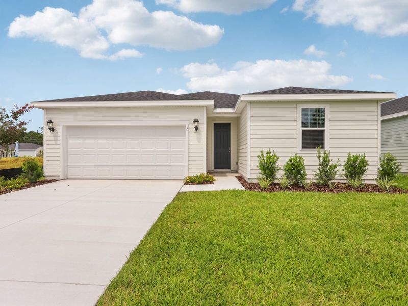 Front exterior of a new home in Flagler Village - Signature Series, Palm Coast, FL, highlighting curb appeal (Image 2).