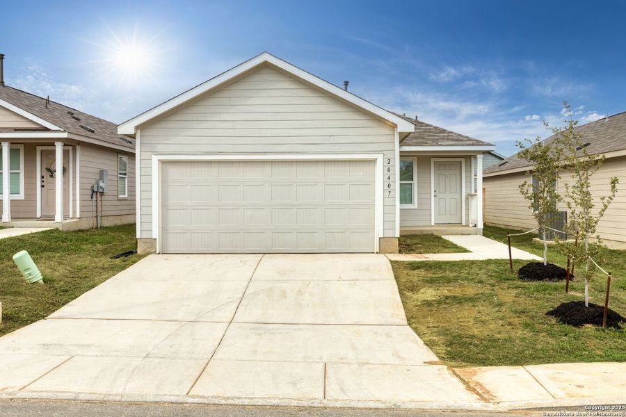 Front exterior of a new home in Ruby Crossing: Cottage Collection, San Antonio, TX, highlighting curb appeal (Image 2).