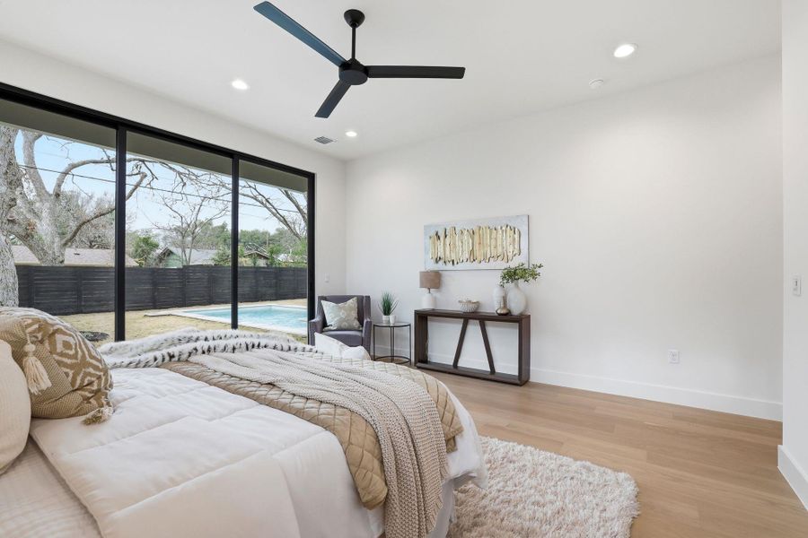 Bedroom with access to outside, light wood-style flooring, recessed lighting, and a ceiling fan
