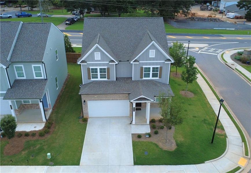 Front exterior of a new home in , Lilburn, GA, highlighting curb appeal (Image 28).