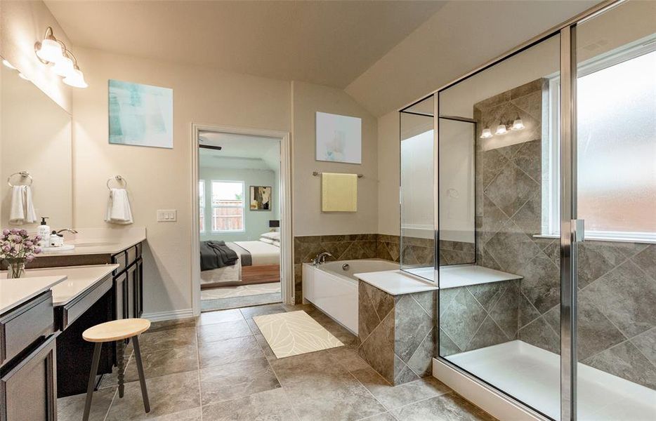 Owner's bath with dual vanity and large shower
 *Photos of furnished model. Not actual home. Representative of floor plan. Some options and features may vary.