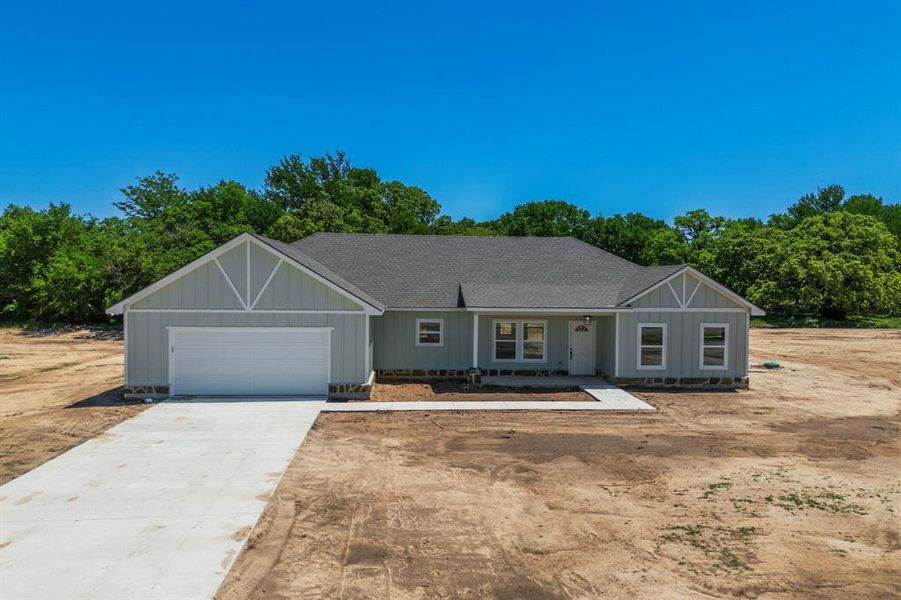 Front exterior of a new home in , Sunset, TX, highlighting curb appeal (Image 1).