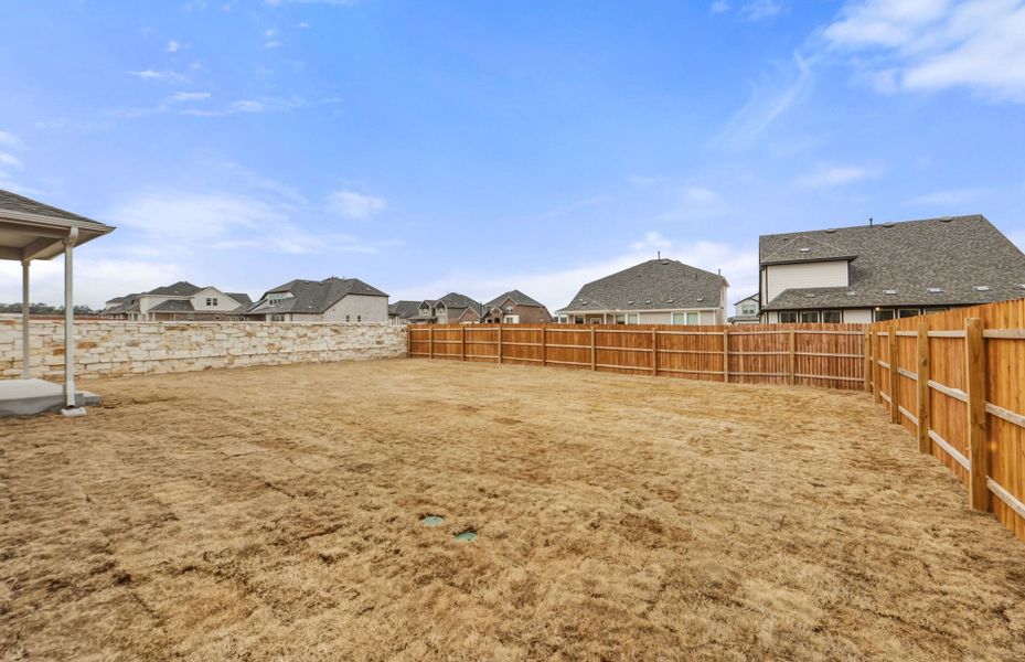 Exterior details and patio area of a home in Saddleback at Santa Rita Ranch, Liberty Hill (Image 29). Exterior details and patio area of a home in Saddleback at Santa Rita Ranch, Liberty Hill (Image 29).