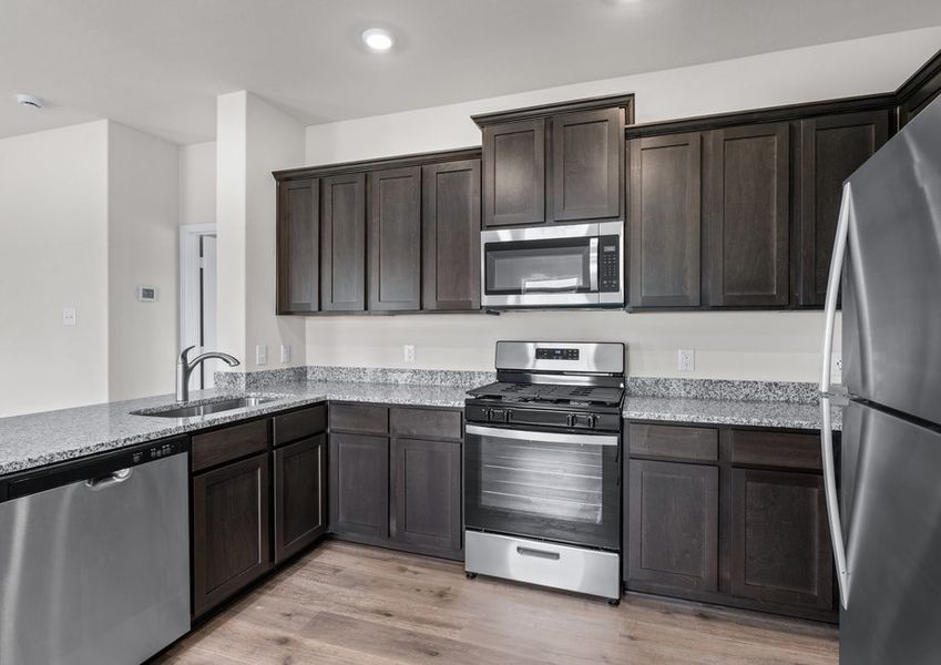 This beautiful kitchen has cabinet space for all of your kitchen essentials.
