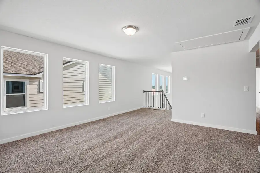 Spacious, unfurnished interior of a new home in The Meadows at Hunters Ranch, San Antonio (Image 29).