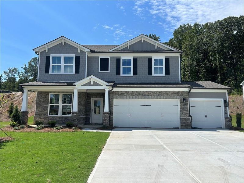 Front exterior of a new home in Hopewell Reserve: Hopewell - 40' Value, Cumming, GA, highlighting curb appeal (Image 1). Front exterior of a new home in Hopewell Reserve: Hopewell - 40' Value, Cumming, GA, highlighting curb appeal (Image 1).