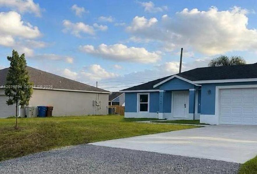 Front exterior of a new home in , Vero Beach, FL, highlighting curb appeal (Image 17). Front exterior of a new home in , Vero Beach, FL, highlighting curb appeal (Image 17).