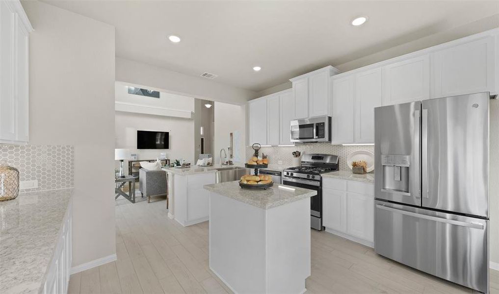 Kitchen with island (*Photo not of actual home and used for illustration purposes only.)