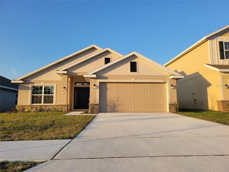 Front exterior of a new home in Arbor Park, Leesburg, FL, highlighting curb appeal (Image 1). Front exterior of a new home in Arbor Park, Leesburg, FL, highlighting curb appeal (Image 1).