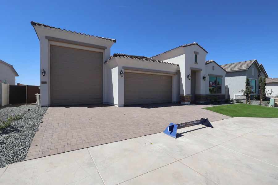 Front exterior of a new home in Tamber at Soleo, San Tan Valley, AZ, highlighting curb appeal (Image 9). Front exterior of a new home in Tamber at Soleo, San Tan Valley, AZ, highlighting curb appeal (Image 9).