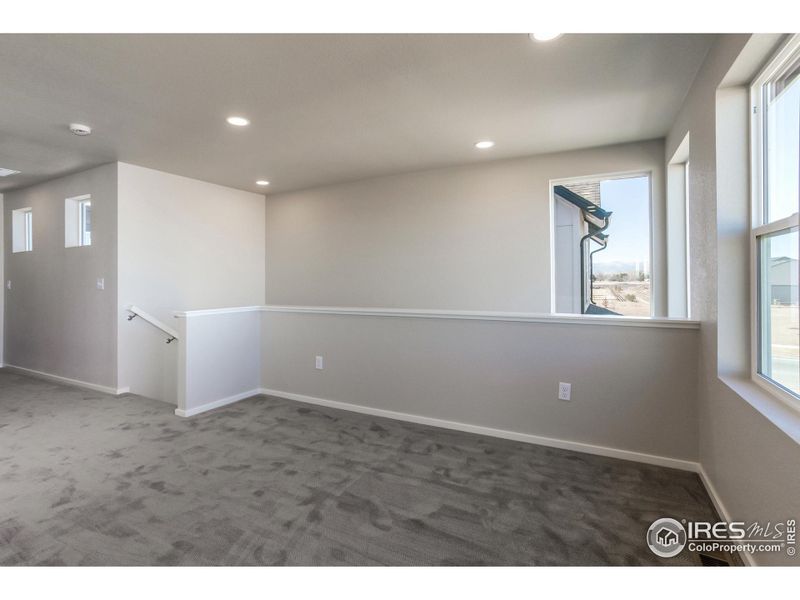 Spacious, unfurnished interior of a new home in Trailside Alley Load - Single Family Homes, Timnath (Image 28).