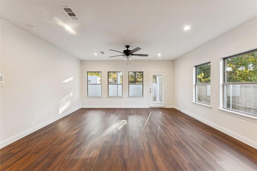 Unfurnished room featuring dark wood-style flooring, recessed lighting, and a ceiling fan