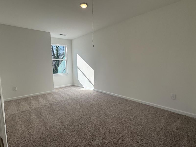 Spacious, unfurnished interior of a new home in East Main Townes, Spartanburg (Image 20).