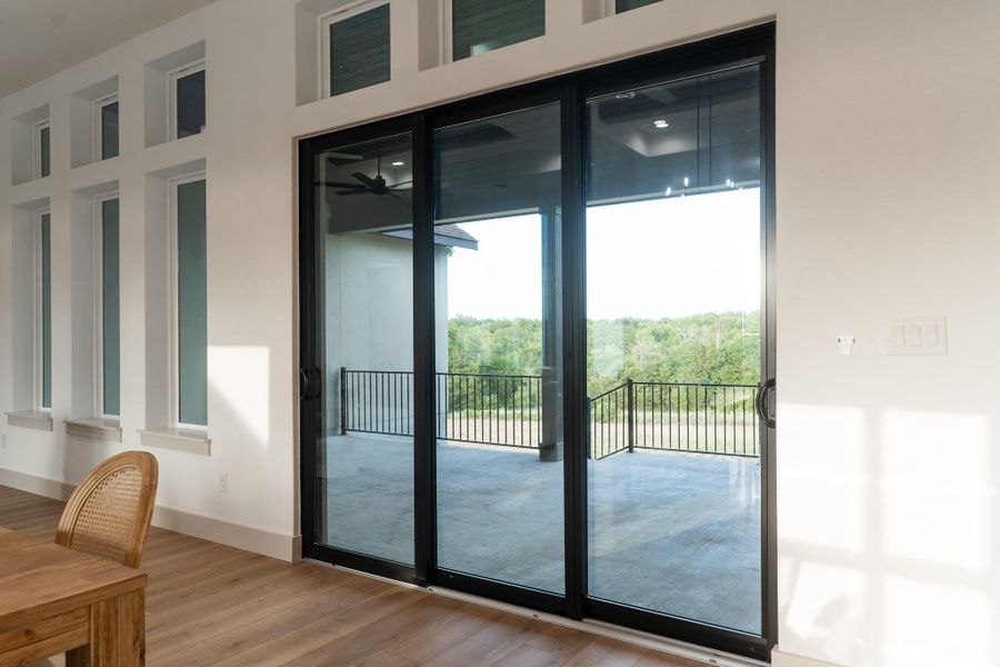 Doorway with wood finished floors and a ceiling fan Doorway with wood finished floors and a ceiling fan