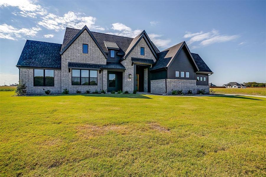 View of front of home featuring a front lawn