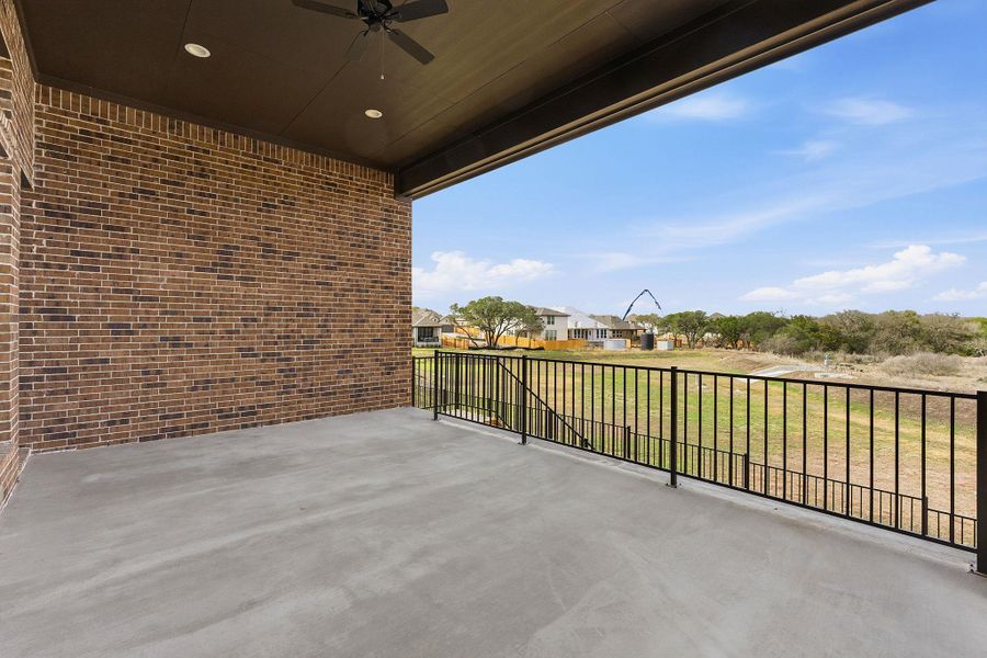 View of patio / terrace featuring ceiling fan and a residential view