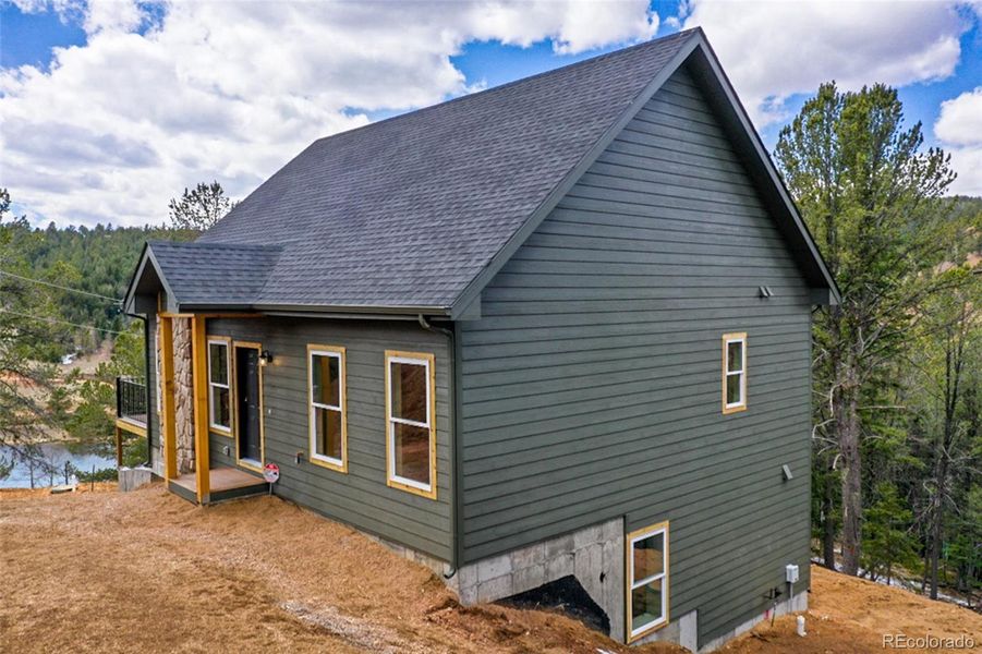 Front exterior of a new home in , Divide, CO, highlighting curb appeal (Image 27). Front exterior of a new home in , Divide, CO, highlighting curb appeal (Image 27).