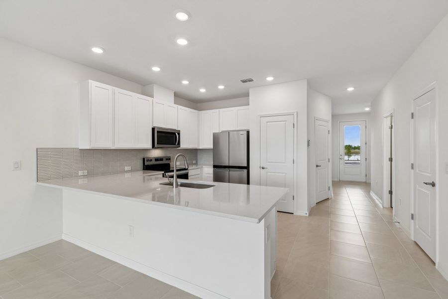 Furnished interior view inside a new home in Waterset Townhomes, Apollo Beach (Image 5).
