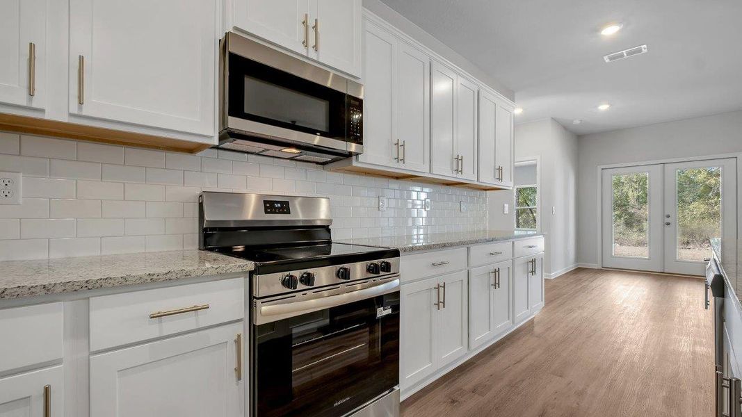 Representative furnished interior of a home built from the The Mckenzie by D.R. Horton in Greystone, Crawfordville (Image 9).