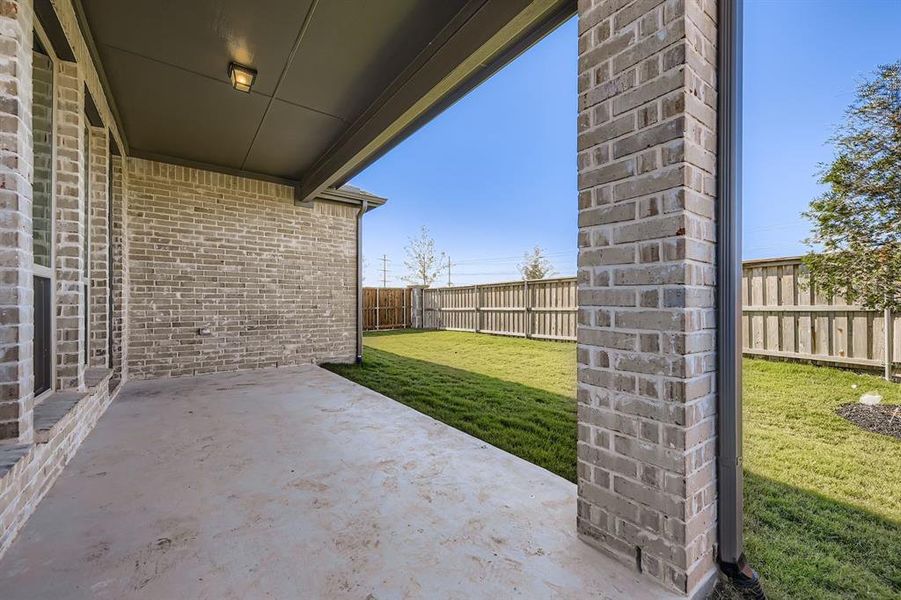 Fenced backyard featuring a patio area