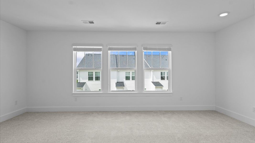 Vibrant natural light fills this exceptional primary suite with eye-catching details Vibrant natural light fills this exceptional primary suite with eye-catching details