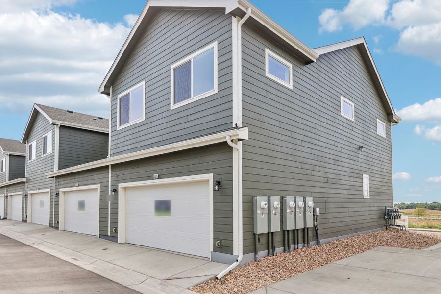 Front exterior of a new home in Liberty Draw, Evans, CO, highlighting curb appeal (Image 2). Front exterior of a new home in Liberty Draw, Evans, CO, highlighting curb appeal (Image 2).