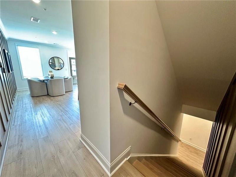 Continuing up the Main Level Living *Photos Showcase Warm Wheat Design Collection from a different Staged Model Home Site*