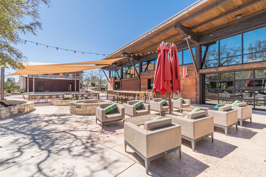 View of patio featuring an outdoor living space with a fire pit