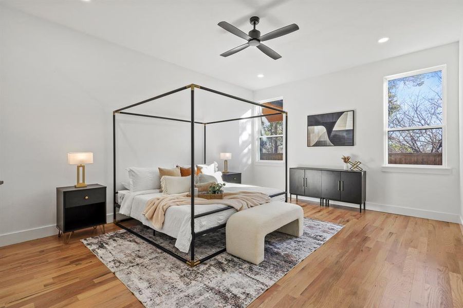 Bedroom with hardwood / wood-style flooring and ceiling fan